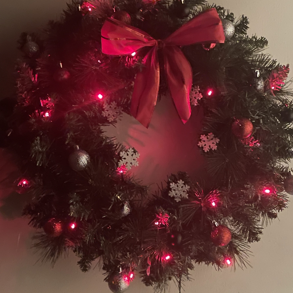 Festive Holiday Wreath with Red Bow and Lights